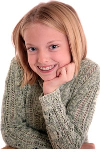 Young girl smiling with braces